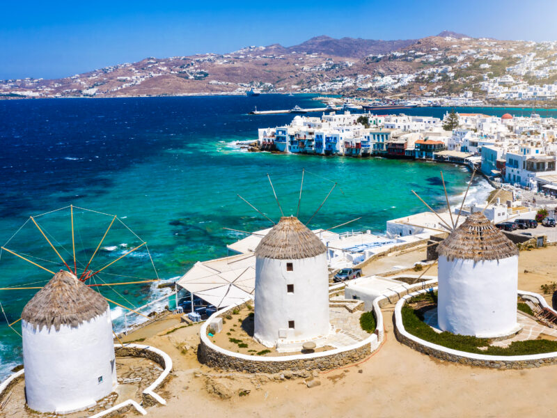 Aerial,View,Through,The,Famous,Windmills,Above,Mykonos,Town,,Cyclades,